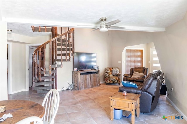 503 Rabbit Run Rd, Victoria, TX 77905 - living room with stairway, a ceiling fan, tile patterned floors, baseboards, and vaulted ceiling