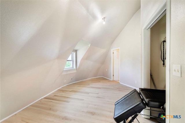 503 Rabbit Run Rd, Victoria, TX 77905 - additional living space with wood finished floors, vaulted ceiling, and baseboards