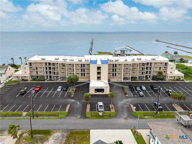 aerial view of apartment complex / building and a nearby body of water