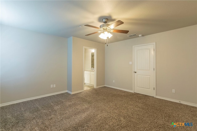 spare room with carpet and ceiling fan