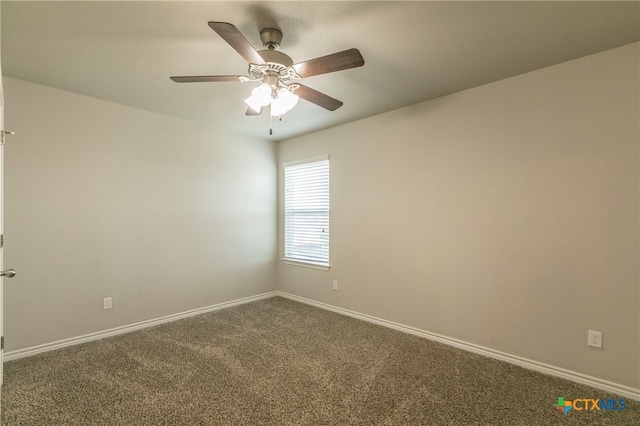 spare room featuring carpet floors and ceiling fan