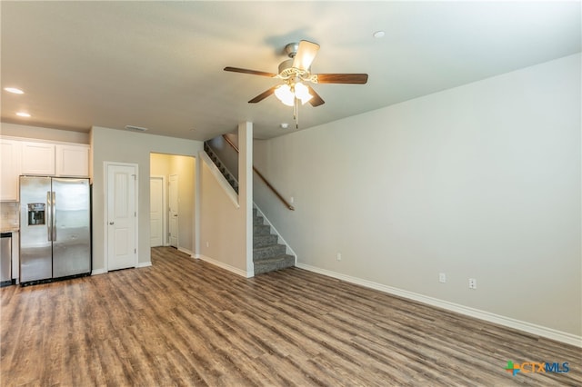 unfurnished living room featuring hardwood / wood-style floors and ceiling fan