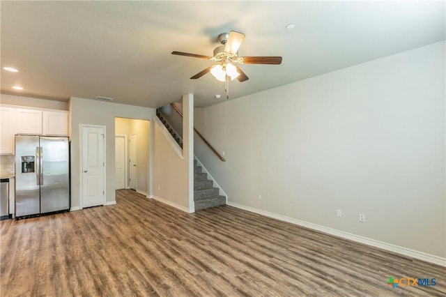 611 Westfield Blvd, Temple, TX 76502 - unfurnished living room with wood finished floors, stairs, a ceiling fan, baseboards, and recessed lighting