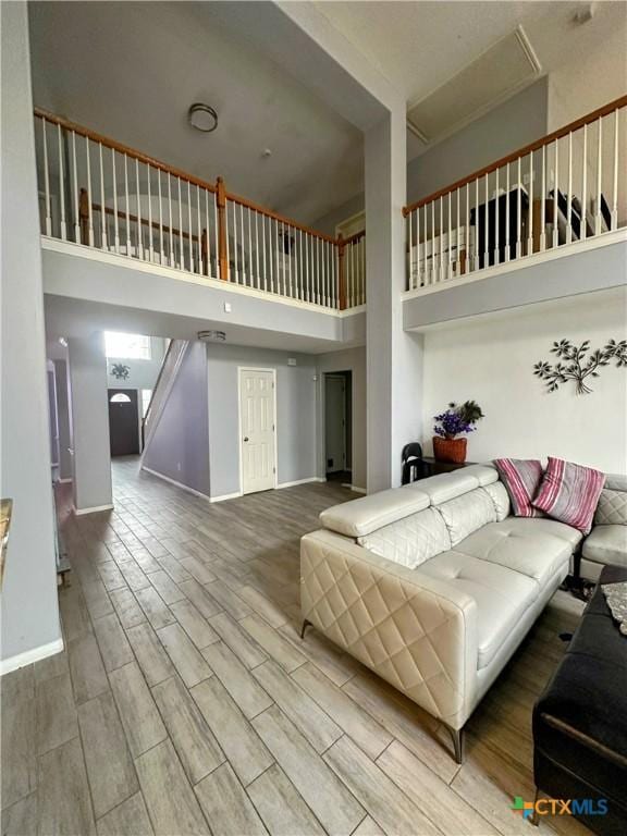 living room featuring a high ceiling