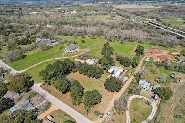 birds eye view of property featuring a rural view