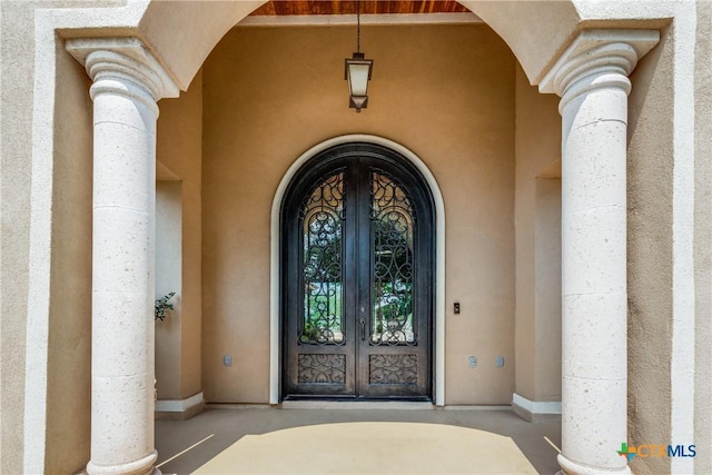 1027 Las Brisas Dr, Canyon Lake, TX 78133 - view of exterior entry with french doors and stucco siding
