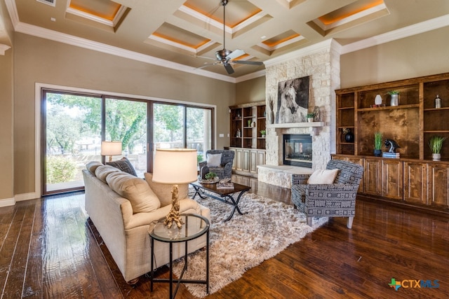 living room with dark wood-type flooring, a healthy amount of sunlight, and coffered ceiling