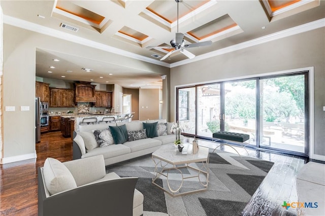 living room featuring ornamental molding, coffered ceiling, ceiling fan, beamed ceiling, and dark hardwood / wood-style floors