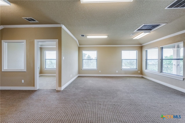 carpeted empty room with a textured ceiling and crown molding