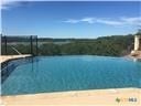 view of pool featuring a water view