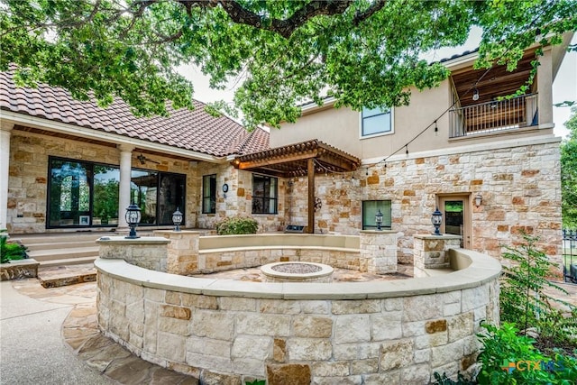 1027 Las Brisas Dr, Canyon Lake, TX 78133 - view of patio with an outdoor fire pit and ceiling fan