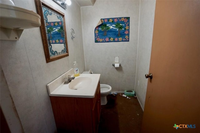 bathroom with vanity and toilet