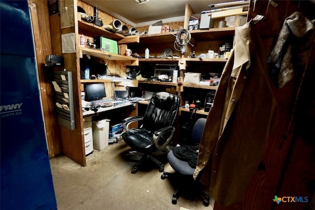 office space featuring built in desk and ornamental molding