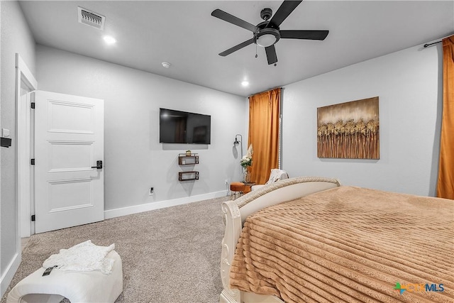 carpeted bedroom featuring baseboards, visible vents, a ceiling fan, and recessed lighting