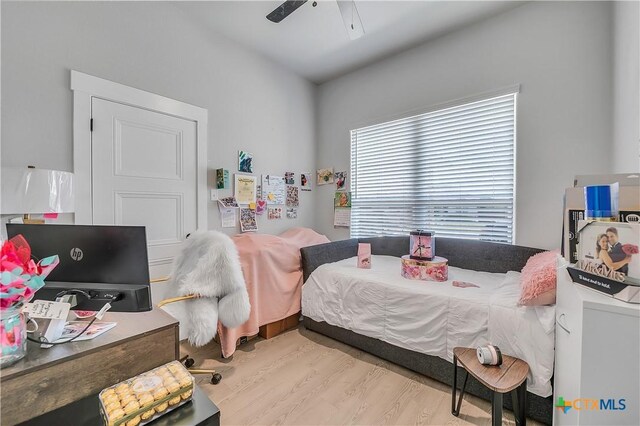 bedroom featuring wood finished floors and a ceiling fan