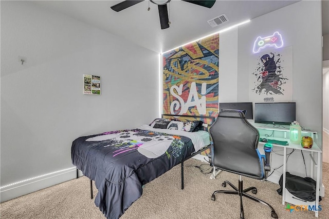 bedroom with carpet floors, visible vents, baseboards, vaulted ceiling, and a ceiling fan