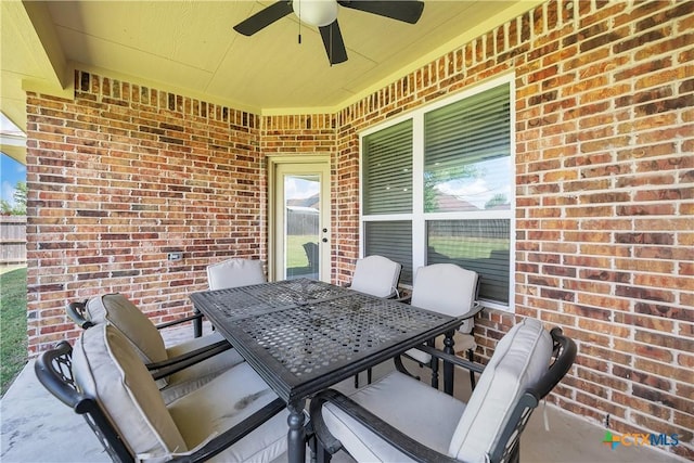 view of patio featuring outdoor dining area and a ceiling fan