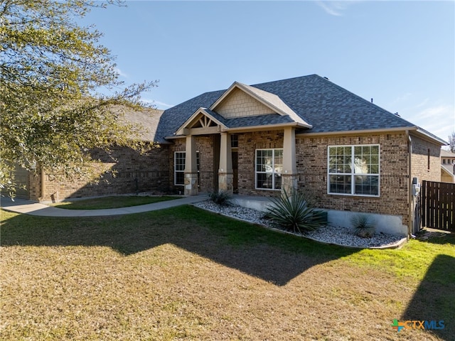 craftsman-style home with a front yard