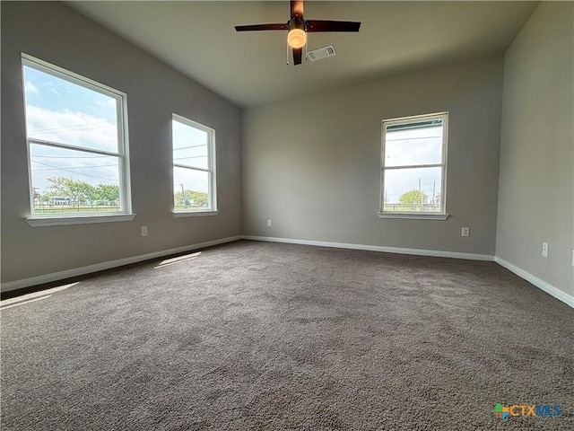 837 Swallow Dr, Palacios, TX 77465 - spare room with baseboards, a ceiling fan, visible vents, and carpet