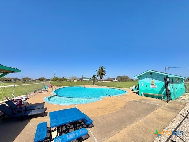 837 Swallow Dr, Palacios, TX 77465 - view of swimming pool featuring fence, a patio, and a fenced in pool