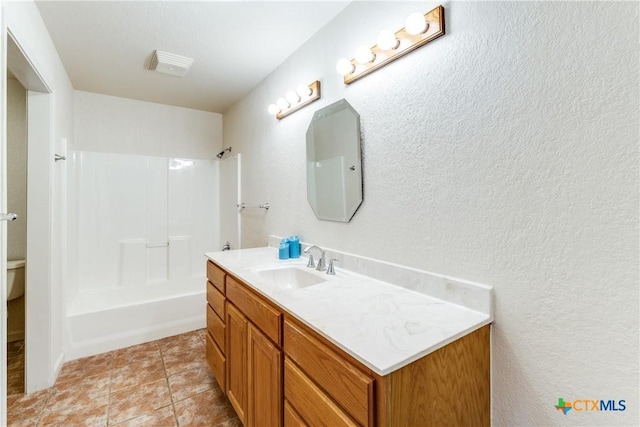 832 Saint James, Seguin, TX 78155 - full bath featuring vanity, shower / tub combination, a textured wall, and tile patterned flooring