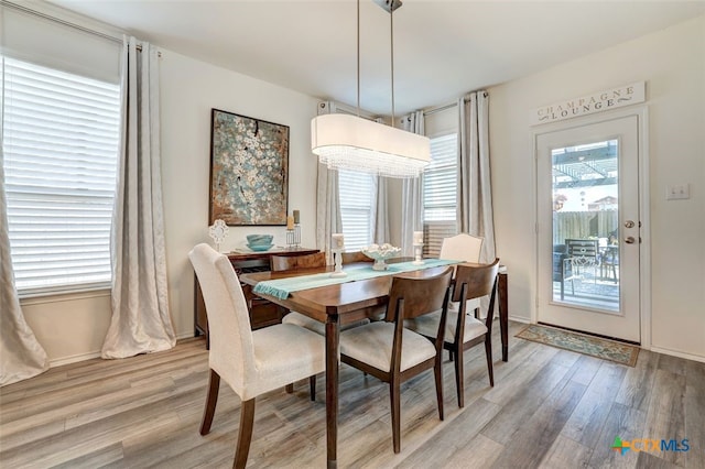 401 Thunder Valley Trl, Georgetown, TX 78626 - dining area with light wood-type flooring and baseboards