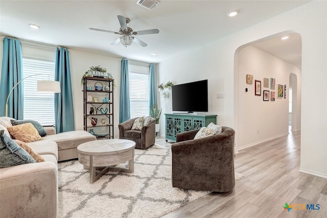 401 Thunder Valley Trl, Georgetown, TX 78626 - living area featuring arched walkways, wood finished floors, ceiling fan, and recessed lighting