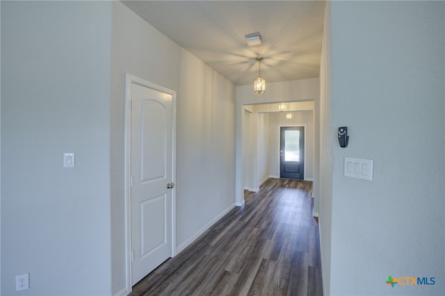 corridor with dark wood-type flooring