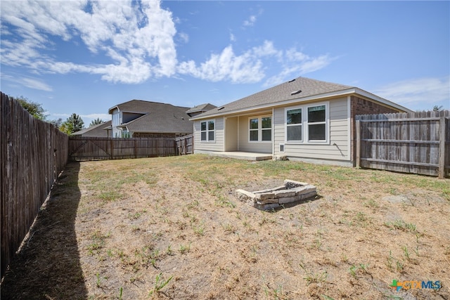 rear view of property featuring a patio area