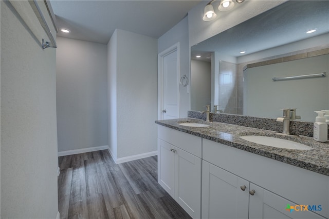 bathroom with hardwood / wood-style floors and vanity