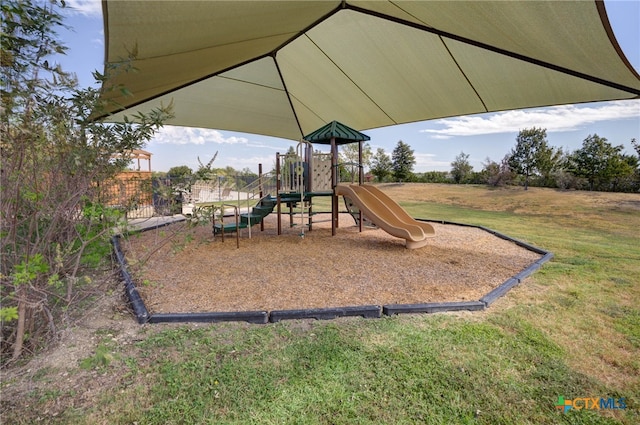 view of play area with a yard