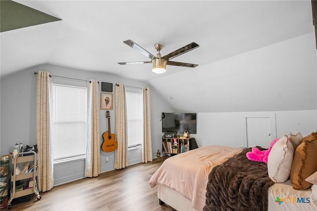 1611 Port Lavaca Dr, Victoria, TX 77901 - bedroom with lofted ceiling, wood finished floors, a ceiling fan, and baseboards