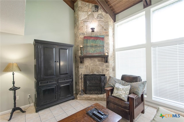 sitting room featuring a stone fireplace, lofted ceiling, wood ceiling, and light tile patterned floors