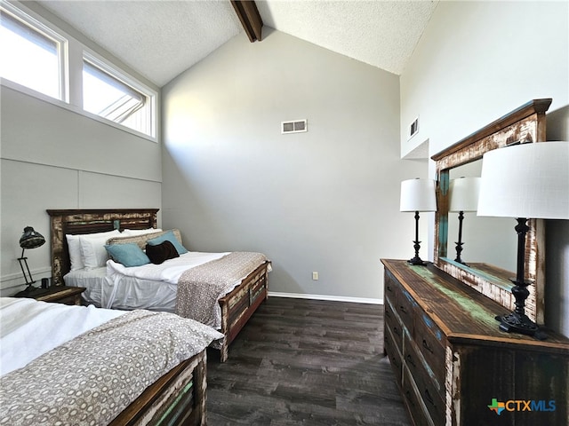 bedroom with dark wood-type flooring, a textured ceiling, and lofted ceiling with beams