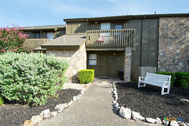 view of front of home with a balcony