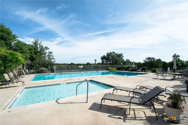 view of pool featuring a patio