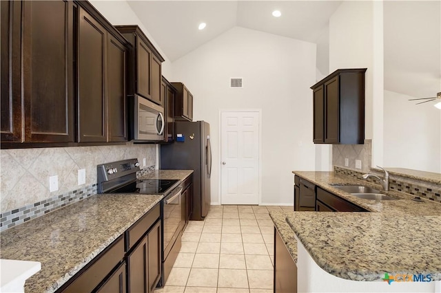 kitchen featuring sink, high vaulted ceiling, black appliances, light tile patterned flooring, and kitchen peninsula