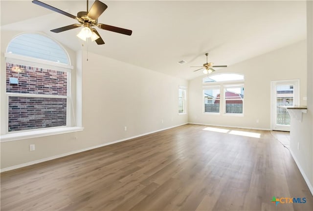 6402 Ambrose Cir, Temple, TX 76502 - unfurnished living room with lofted ceiling, a ceiling fan, and wood finished floors