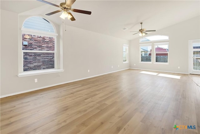 6402 Ambrose Cir, Temple, TX 76502 - empty room featuring lofted ceiling, ceiling fan, plenty of natural light, and light wood finished floors