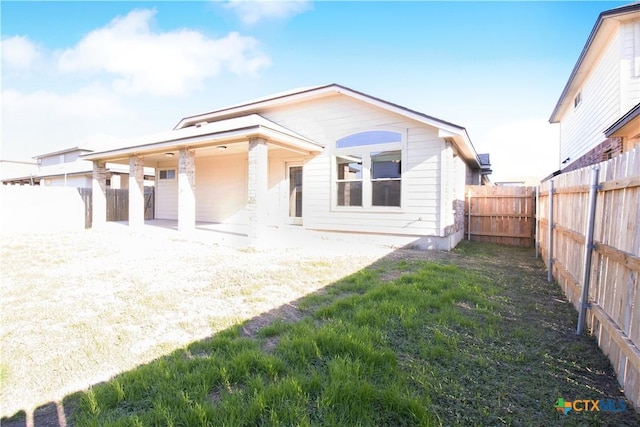 6402 Ambrose Cir, Temple, TX 76502 - back of house with a fenced backyard and a patio area