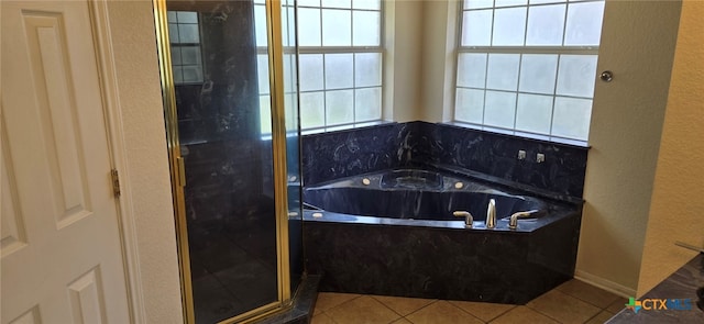 bathroom with separate shower and tub, tile patterned floors, and plenty of natural light