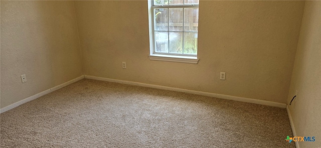 view of carpeted spare room