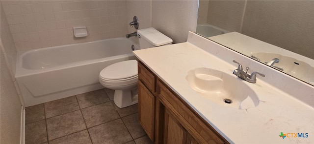 full bathroom featuring toilet, washtub / shower combination, vanity, and tile patterned flooring