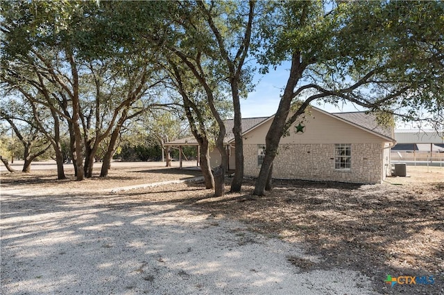 view of property exterior featuring central air condition unit