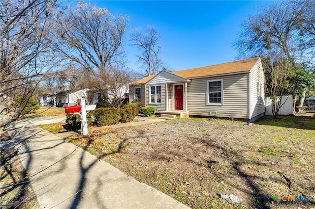 ranch-style home featuring a front yard