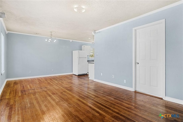 unfurnished living room with hardwood / wood-style flooring, crown molding, and a textured ceiling