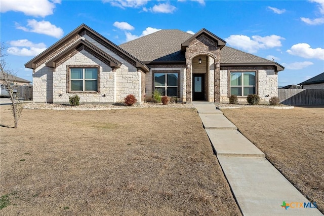 view of front of home with a front lawn