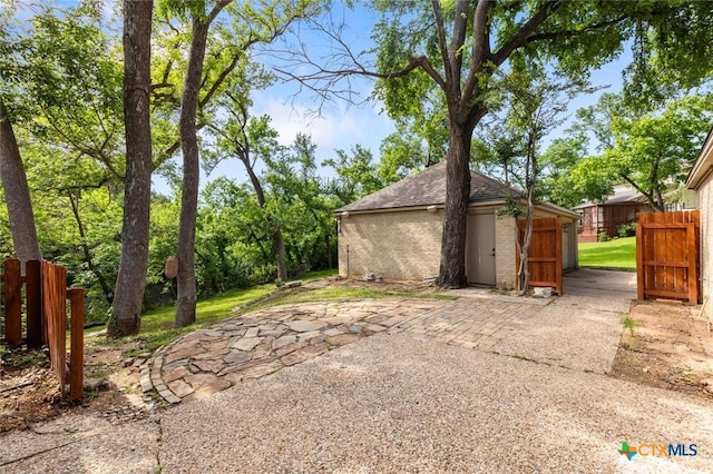 3002 Arrowhead Dr, Temple, TX 76502 - garage with fence and a storage unit
