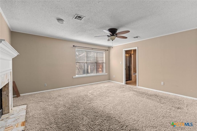 3002 Arrowhead Dr, Temple, TX 76502 - unfurnished living room featuring ceiling fan, a fireplace with raised hearth, ornamental molding, carpet, and baseboards