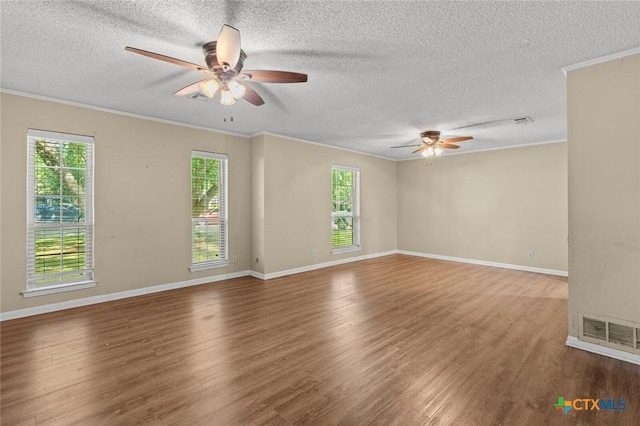 3002 Arrowhead Dr, Temple, TX 76502 - unfurnished room with ceiling fan, a textured ceiling, wood finished floors, ornamental molding, and baseboards